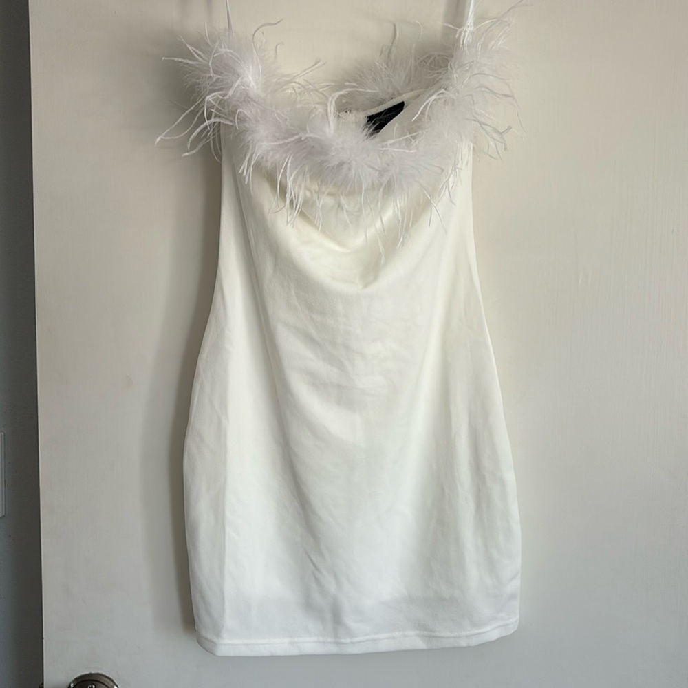 White dress with top feather trim